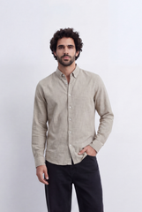Men's beige linen blend slim fit button down shirt by tomato store, paired with black trousers.