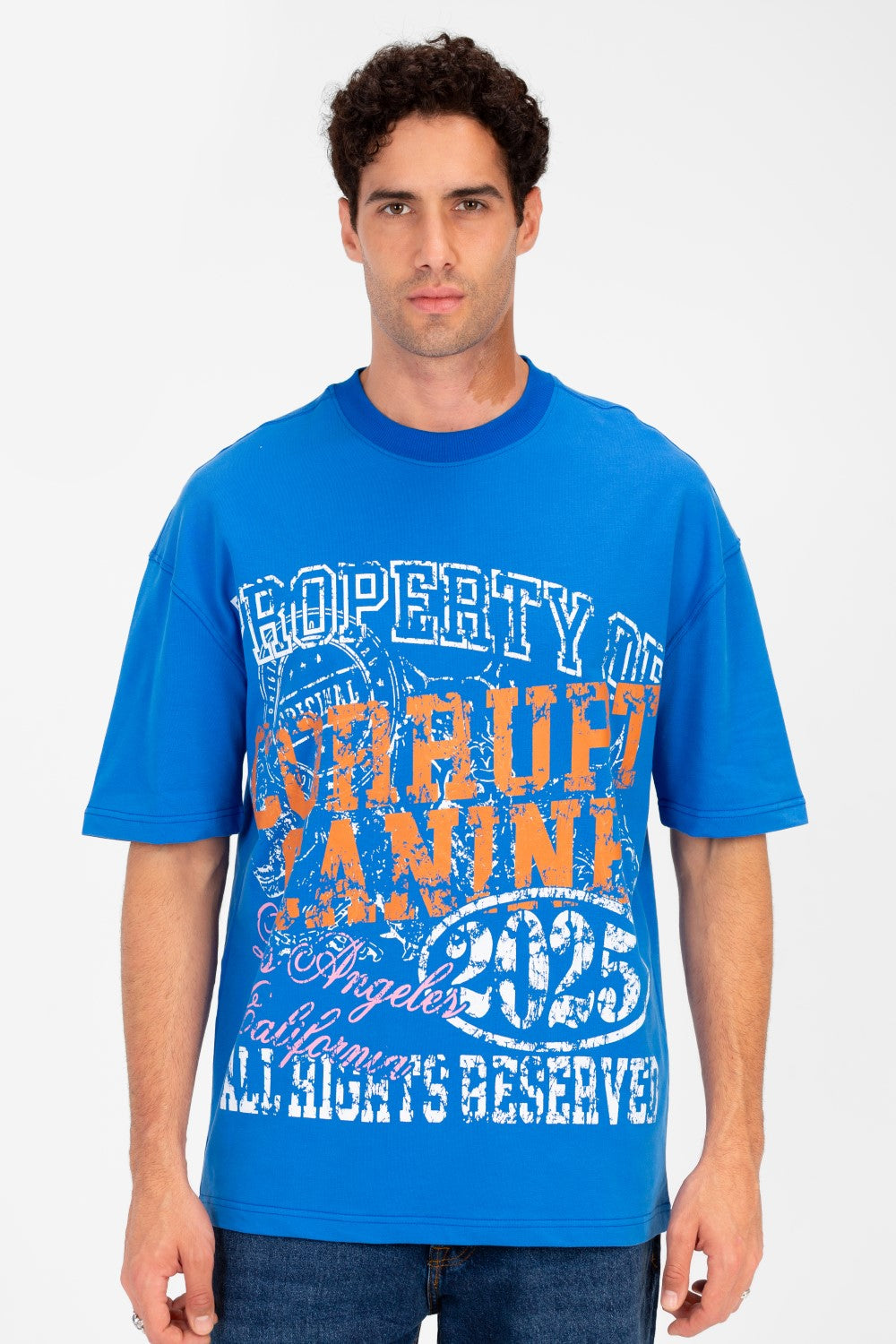 Men’s blue oversized graphic t-shirt with vintage college artwork by tomato store.