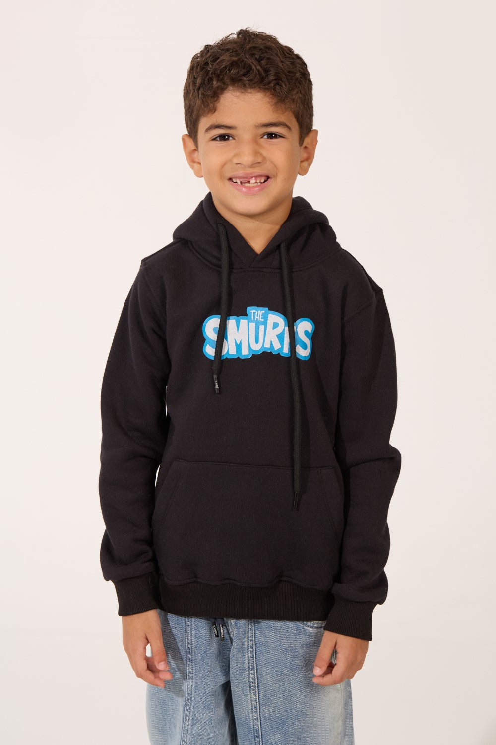 Smurfs Slim Fit Boy's Hoodie in black with blue logo by tomato store, paired with denim jeans.