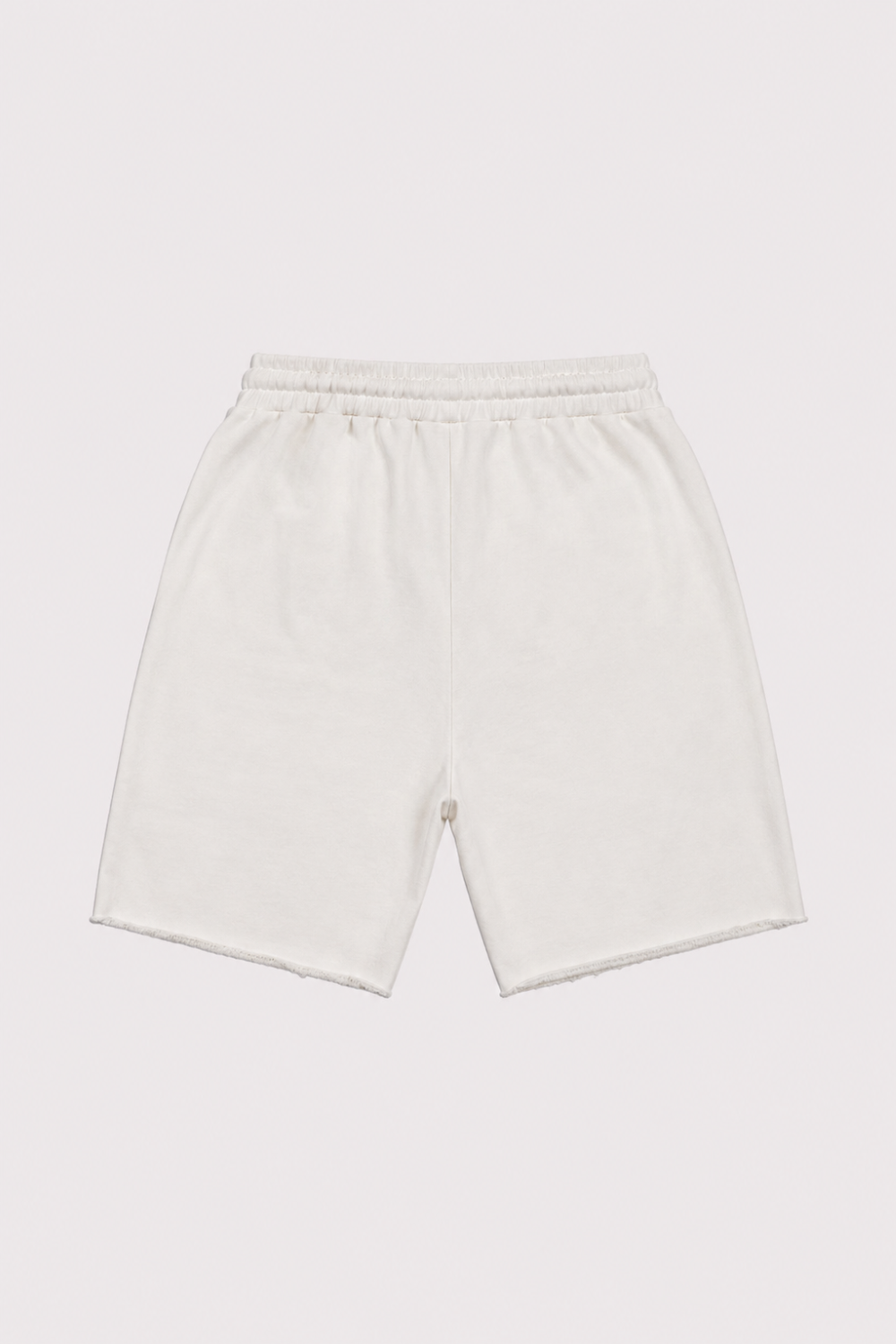 A pair of light cream or off-white cotton shorts with an elastic waistband, laid flat against a solid light gray background.