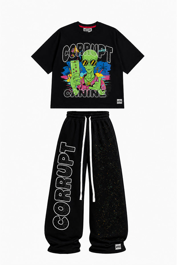 Black graphic t-shirt with an alien holding a drink and "CORRUPT CANINE" text, paired with black sweatpants with "CORRUPT" text.